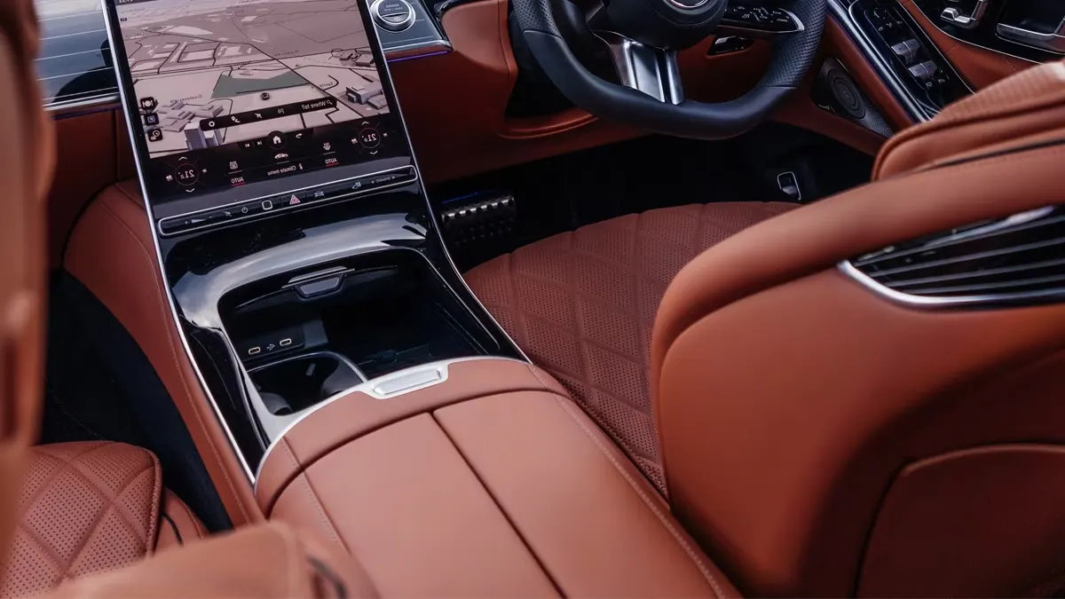 Luxury Mercedes executive vehicle interior with cognac leather seats and touchscreen infotainment